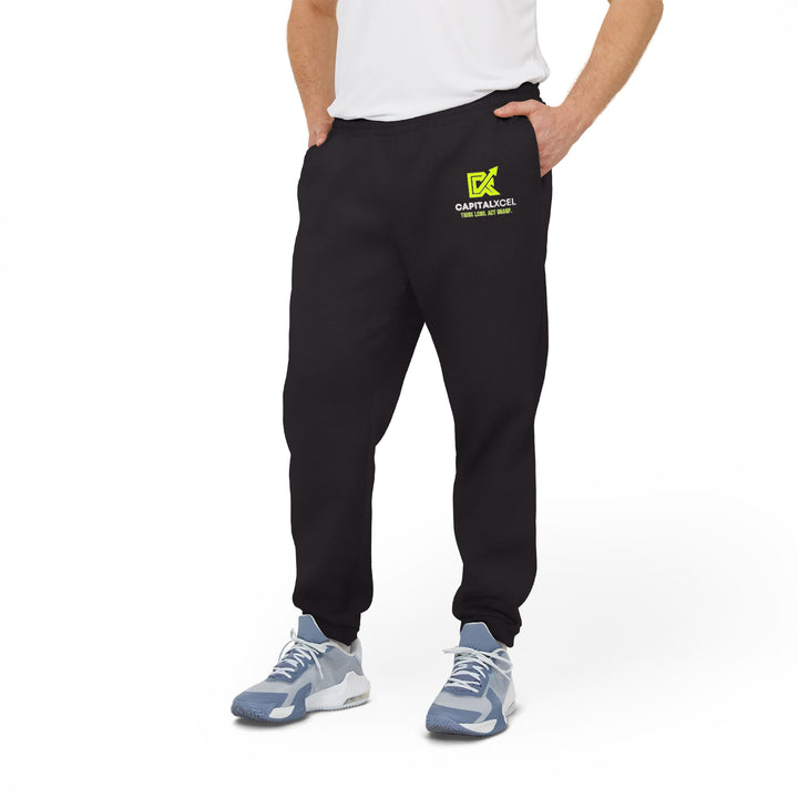 Unisex Adidas fleece joggers with cuffed hems and logo, designed for comfort and eco-friendly everyday athleisure.

