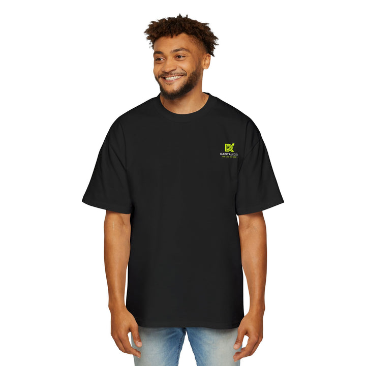 Men's oversized black cotton t-shirt with bold white text reading "I'm Not Rich. I'm Just Focused." and dropped shoulder fit.