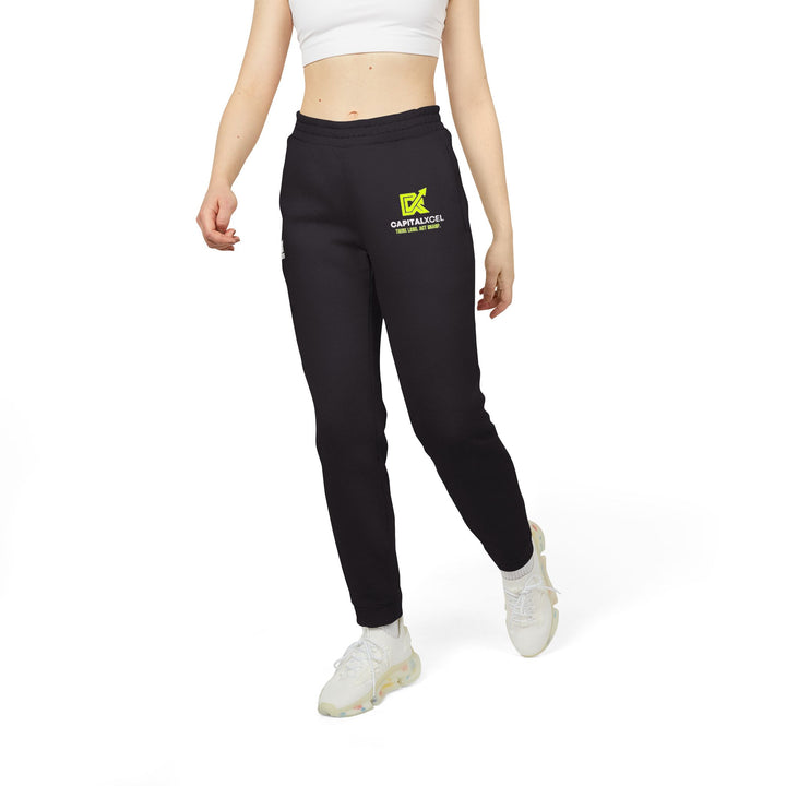 Unisex Adidas fleece joggers with cuffed hems and logo, designed for comfort and eco-friendly everyday athleisure.

