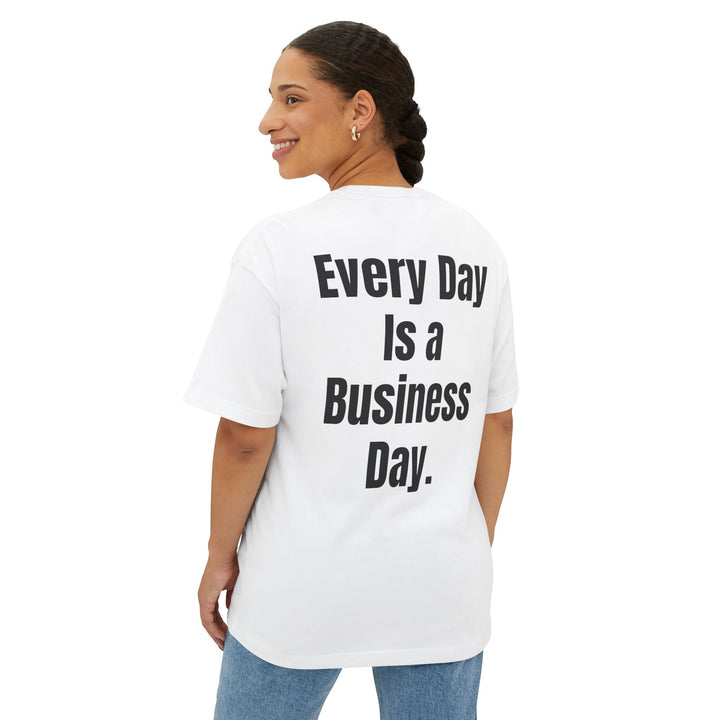 Unisex oversized boxy tee with "Every Day Is a Business Day" slogan, relaxed fit, dropped shoulders, and soft cotton fabric for comfort and style.