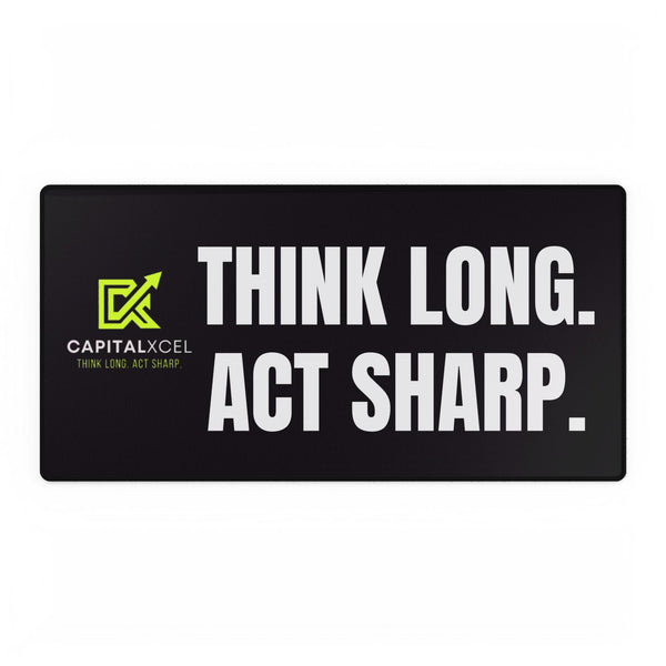 Black motivational desk mat with "Think Long. Act Sharp." slogan, smooth surface for mouse and keyboard use, durable rubber base, and anti-fray edges for long-lasting use.